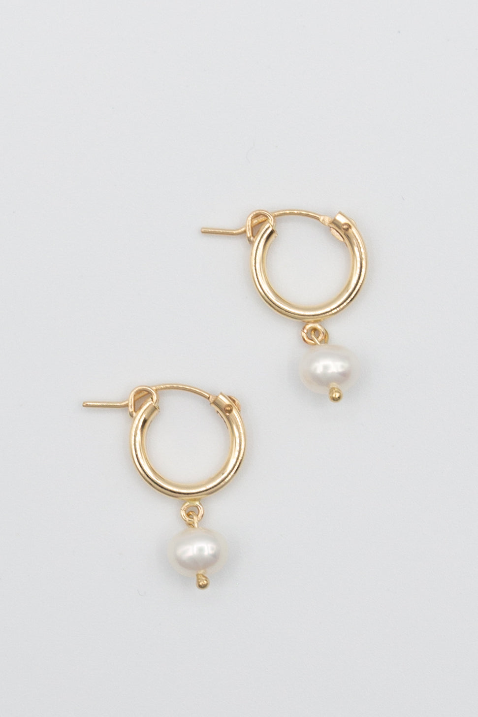 Gold hoop with pearl drop earring